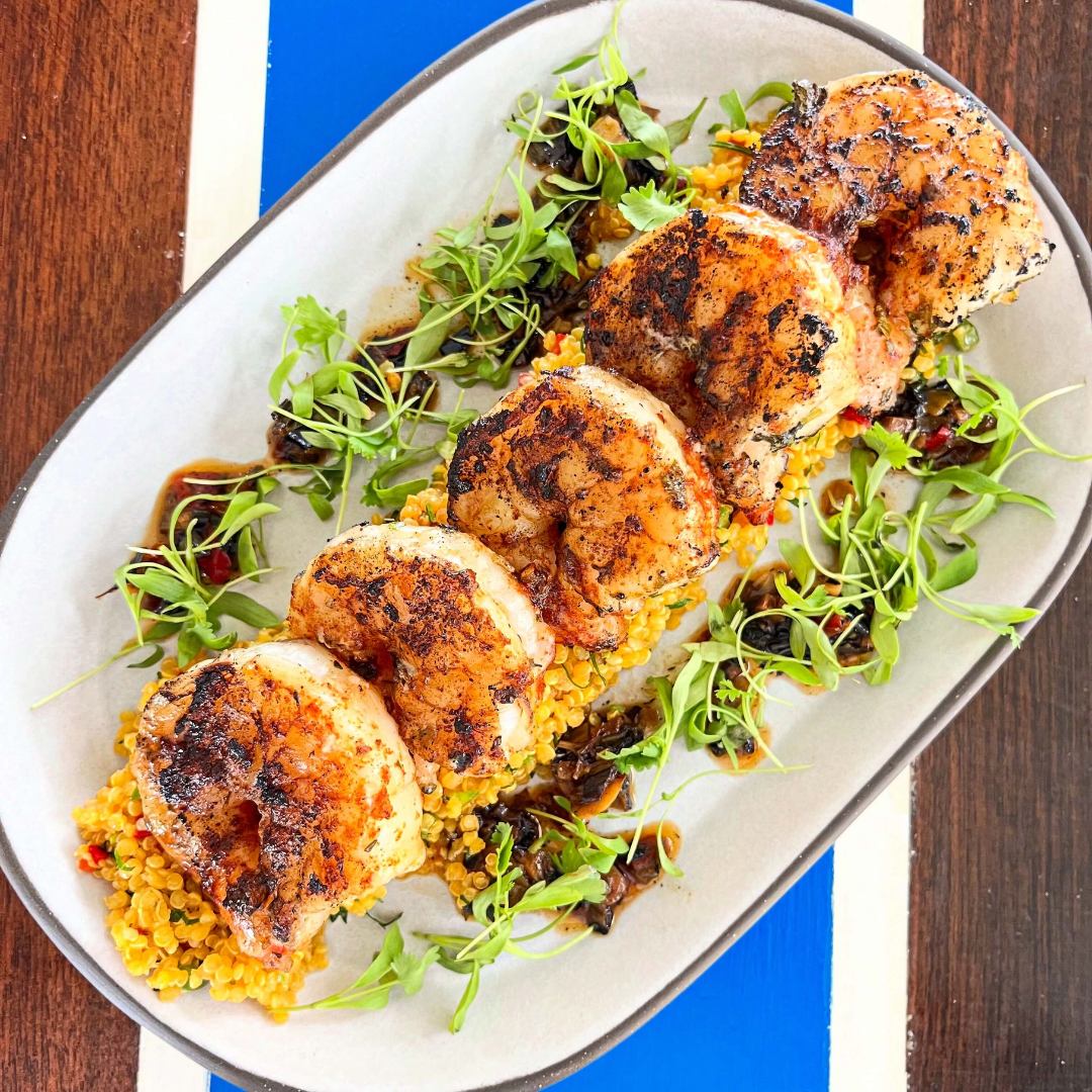 Grilled jumbo shrimp, quinoa tabbouleh, red condimento.
NICHOLSON MUIR