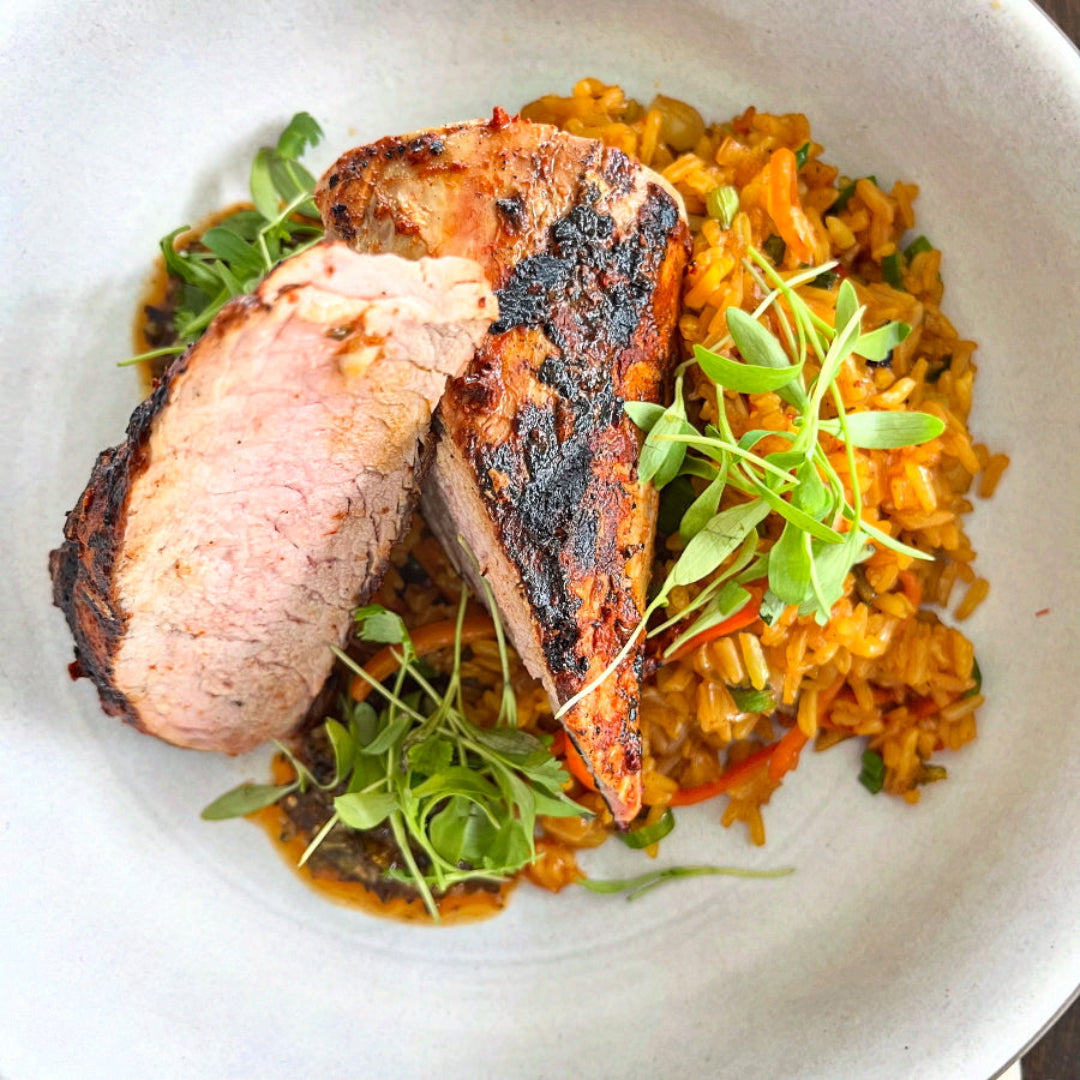 Pastor marinated pork tenderloin, kimchi fried rice, smoked red chimichurri.

NICHOLSON MUIR BOYNTON BEACH